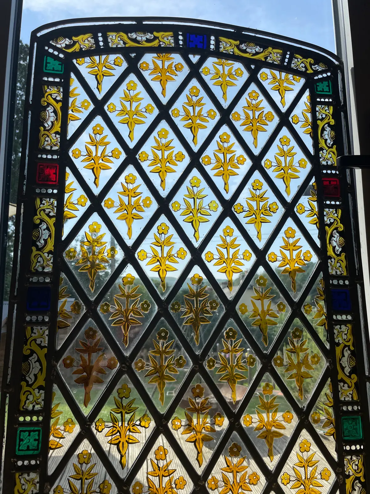 Closeup of a finished window, with clean glass and new lead