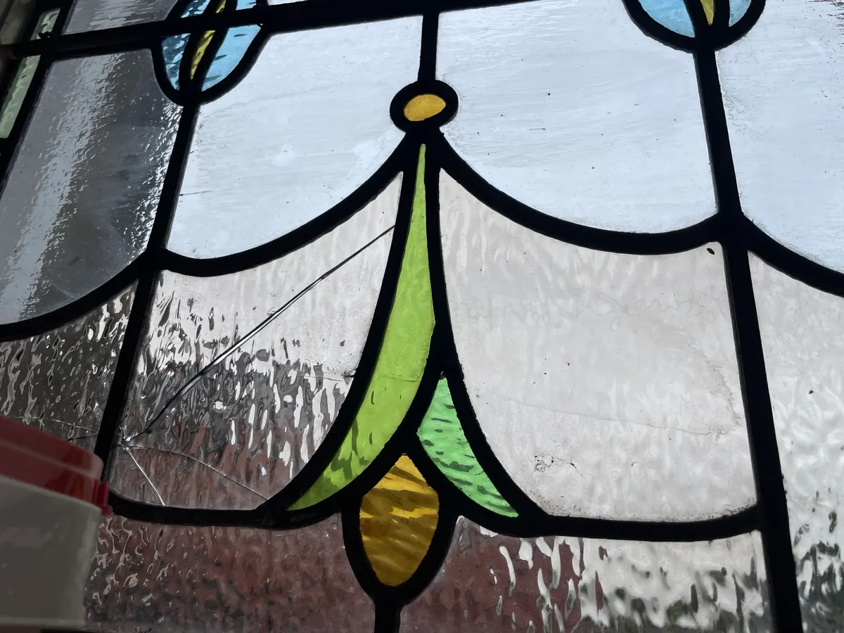 A cracked panel in a stained glass window